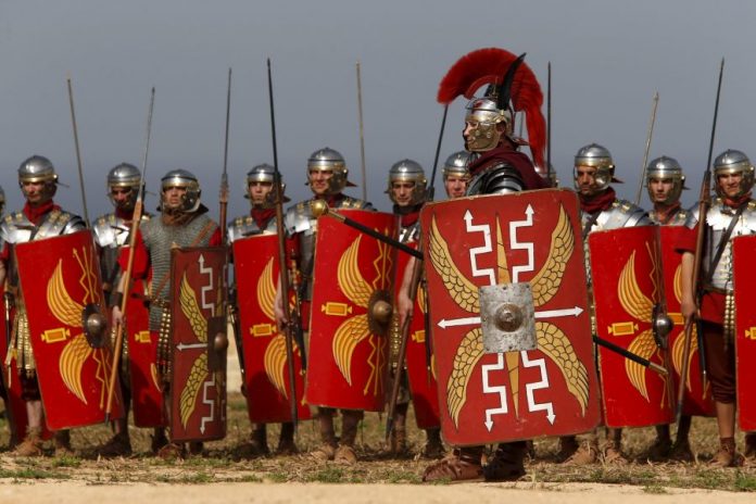 Members of the Legio X Fretensis (Malta) re-enactment group take part in a display of ancient Roman army life at Fort Rinella in Kalkara, outside Valletta