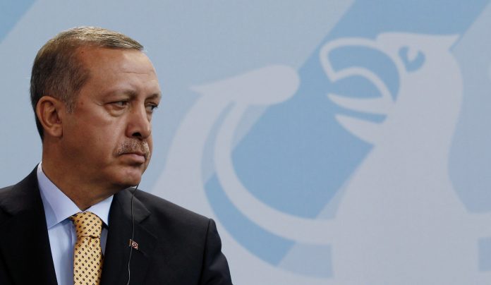 Turkish Prime Minister Erdogan addresses a news conference in Berlin
