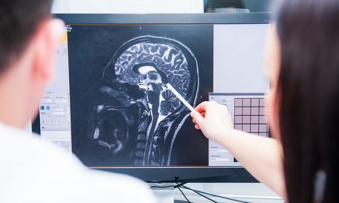 bigstock-Doctors-Consider-And-Discuss-M-168238847